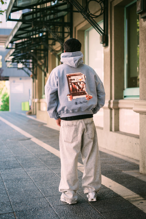 Polerón/Hoodie boxy fit gris melange con diseño coffee run espalda